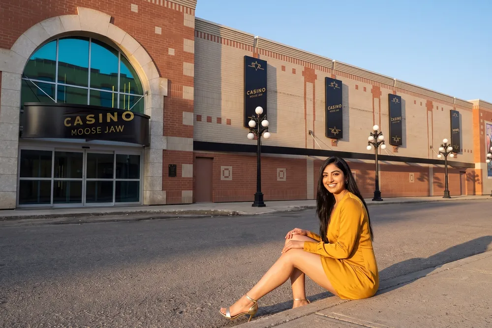 A woman on the kerb outside Casino Moose Jaw